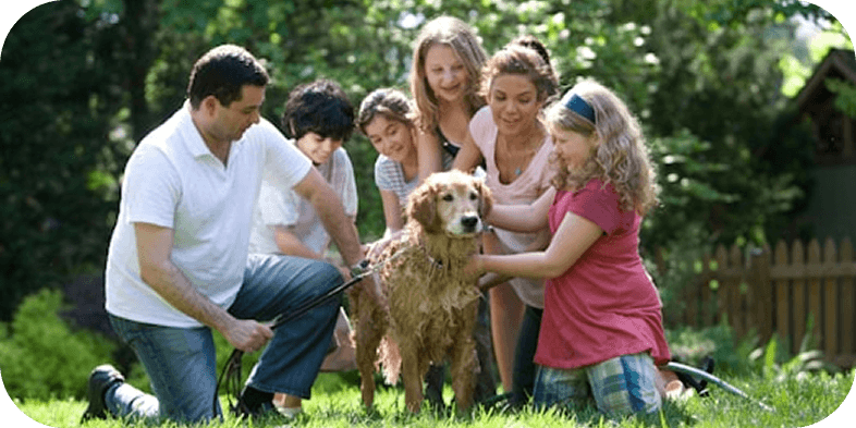 Family outside with dog